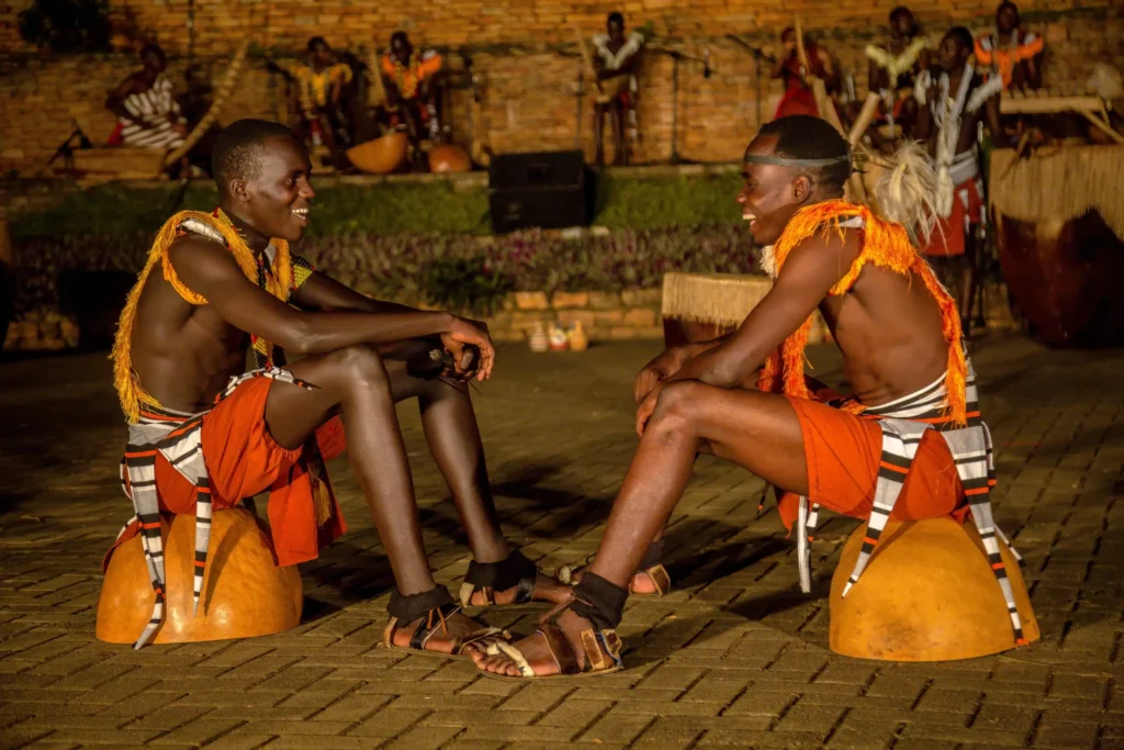Traditional dancers resting during a performance at the Ndere Cultural Centre