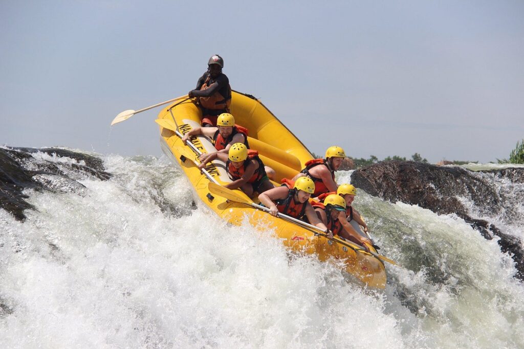 Raft crashing through white-water rapids on the Nile near Jinja