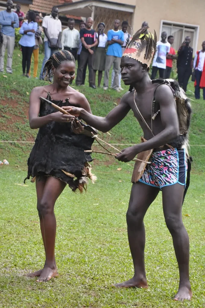 Acholi couple dressed in goat skins and fabric before a dance