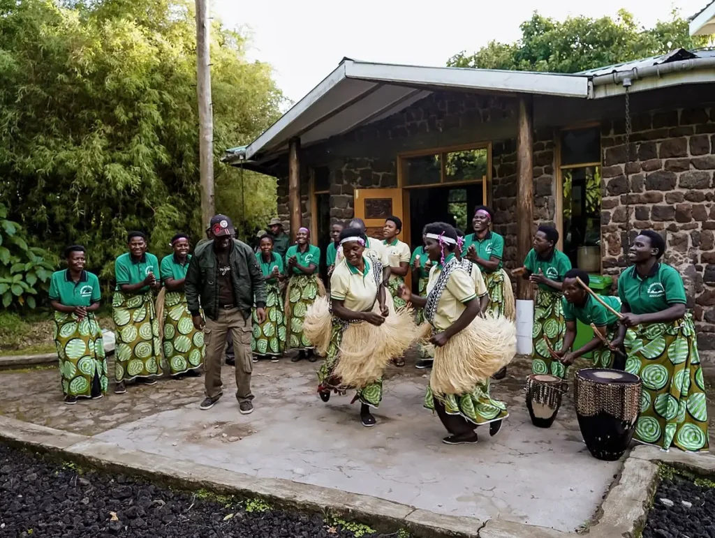Batwa women performing a traditional dance at their community centre in Uganda