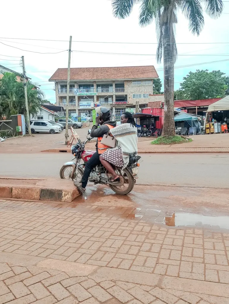 Boda-boda rider preparing to carry a passenger in Kabalagala, Kampala