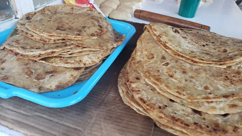 Freshly cooked chapatis stacked on a tray