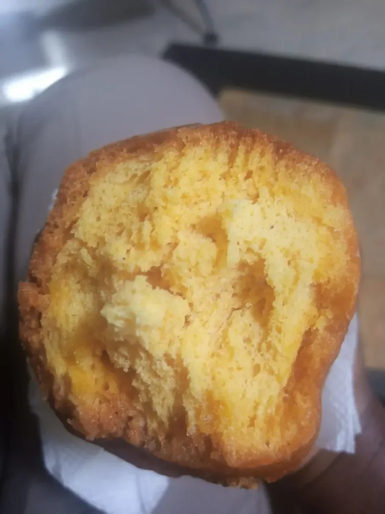 Mandazi split in two, a Ugandan breakfast snack