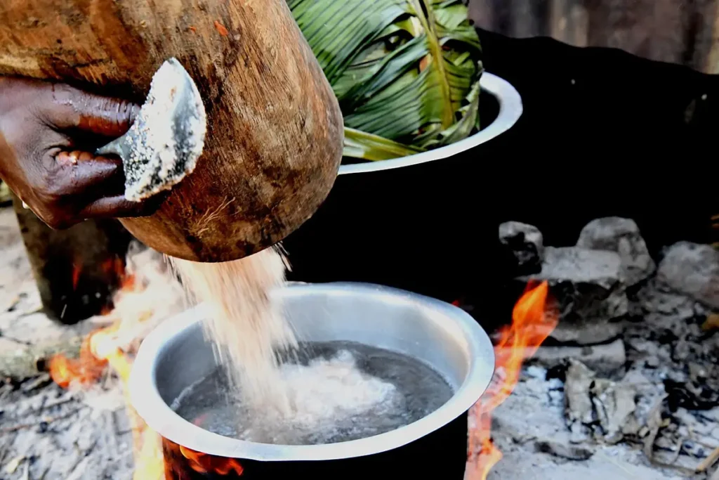 Preparing a matooke and groundnut meal in Uganda