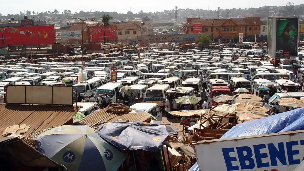 Minibus taxis packed together in central Kampala