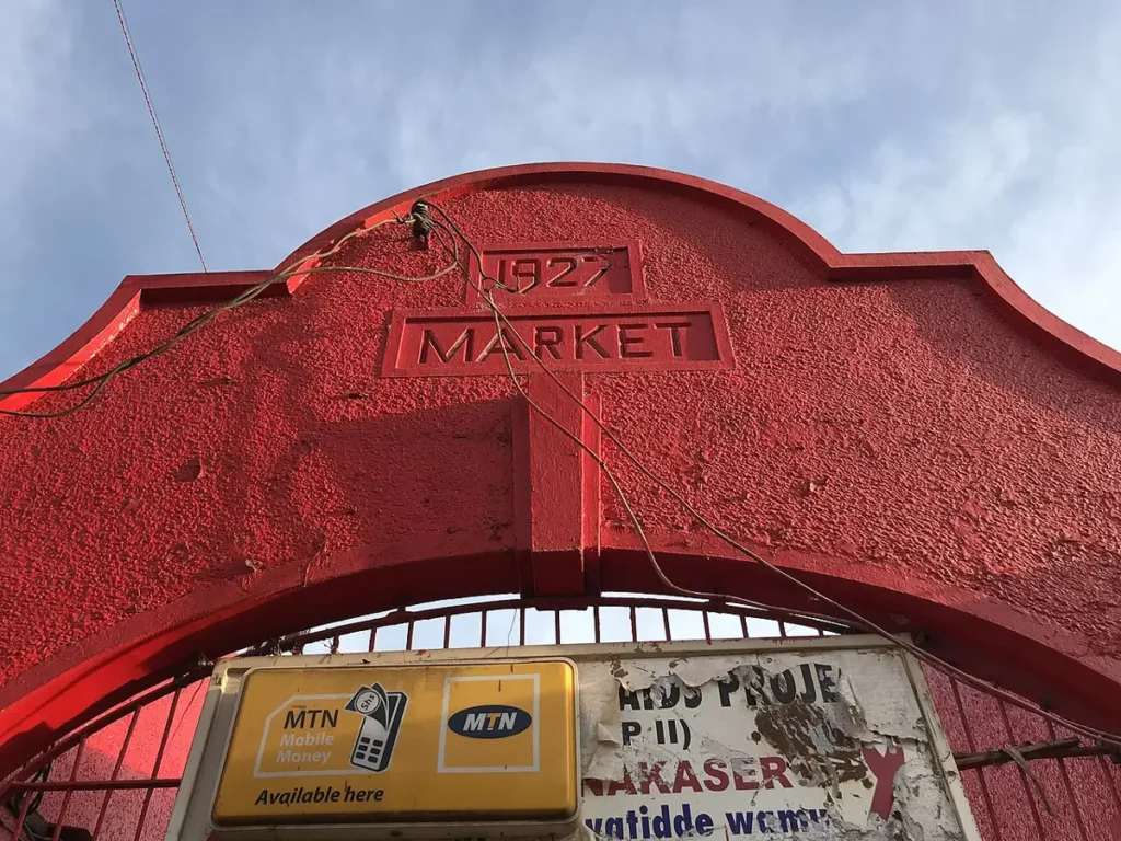 Red entrance arch of Nakasero market, built in 1927, in Kampala