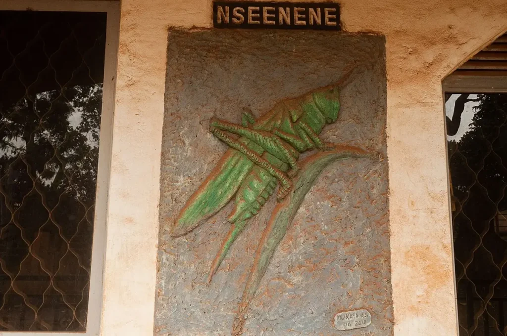 Wall sculpture of a grasshopper, the Nsenene clan totem of Buganda